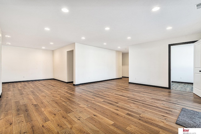 unfurnished room with light hardwood / wood-style flooring