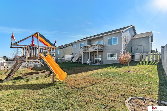 view of play area featuring a lawn