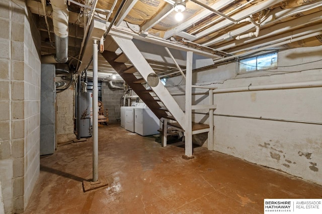 basement featuring washing machine and dryer and gas water heater