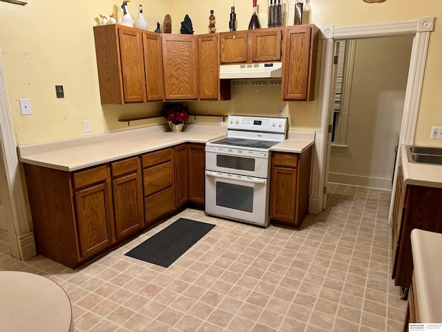 kitchen with white range oven and sink