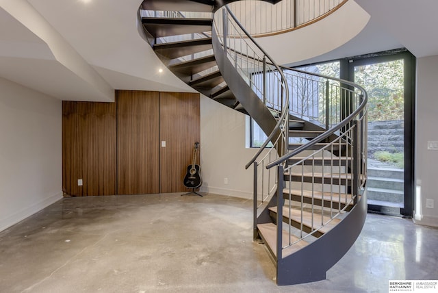 stairway with concrete floors