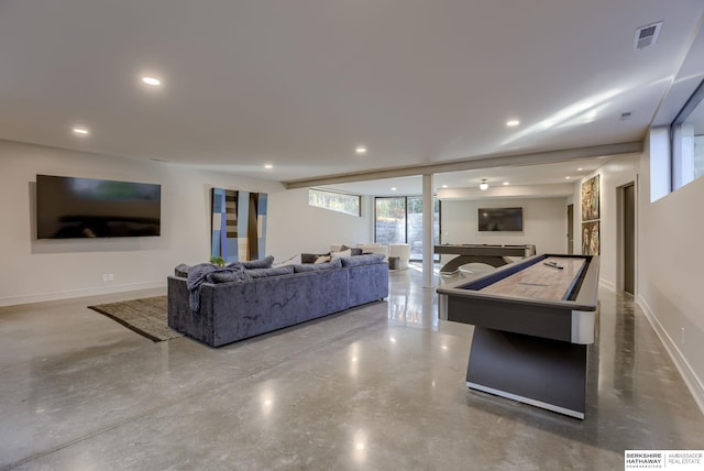 living room featuring concrete flooring