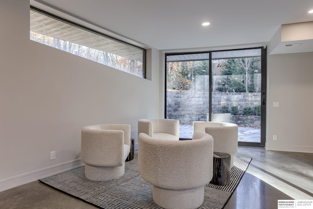 sitting room with concrete flooring