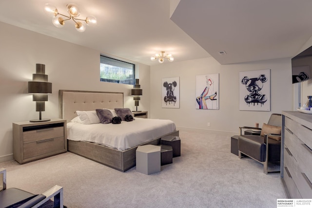 carpeted bedroom with a notable chandelier