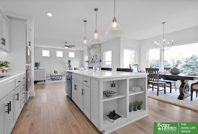 11018 N 161st St, Bennington, NE 68007 - kitchen featuring a sink, white cabinets, plenty of natural light, a ceiling fan, and recessed lighting