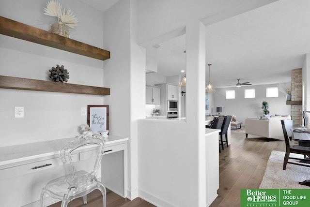 kitchen featuring white cabinets, ceiling fan, dark hardwood / wood-style flooring, and stainless steel appliances