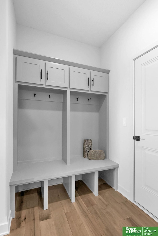 mudroom with light hardwood / wood-style floors