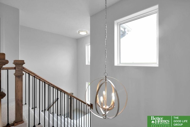 room details featuring a notable chandelier and carpet floors