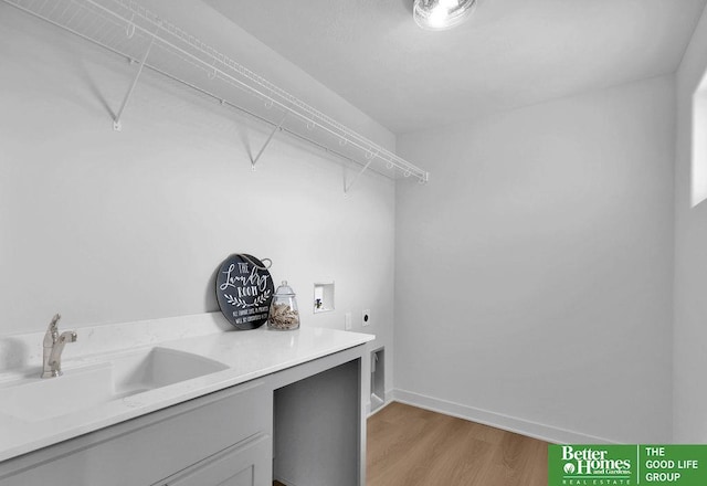 11018 N 161st St, Bennington, NE 68007 - laundry area featuring electric dryer hookup, light wood finished floors, hookup for a washing machine, and baseboards