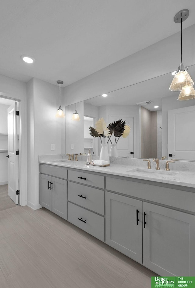 11018 N 161st St, Bennington, NE 68007 - bathroom with double vanity, baseboards, and recessed lighting