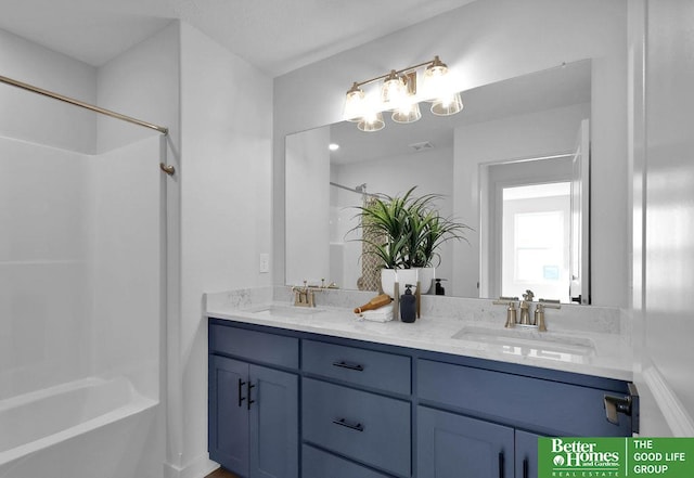 bathroom with vanity and shower / bath combination