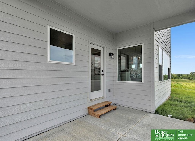 doorway to property featuring a patio area