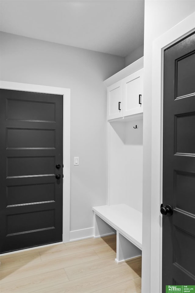 mudroom with light hardwood / wood-style flooring