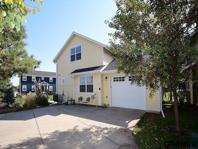 view of front property with central AC unit