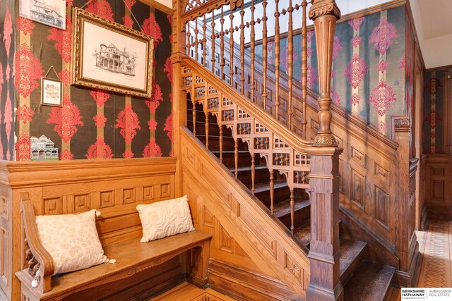 stairs featuring hardwood / wood-style flooring