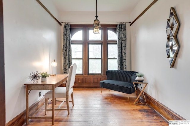 living area with hardwood / wood-style flooring