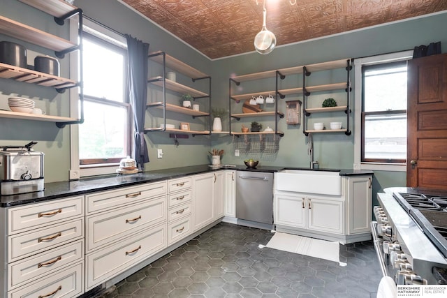 kitchen with white cabinetry, plenty of natural light, sink, and appliances with stainless steel finishes