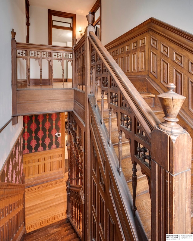 staircase featuring hardwood / wood-style floors