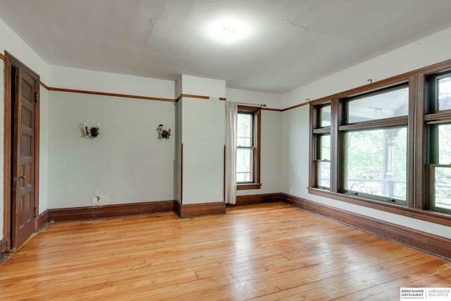 spare room featuring light hardwood / wood-style floors