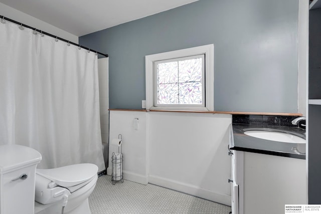 full bathroom featuring shower / bath combo, vanity, toilet, and tile patterned floors