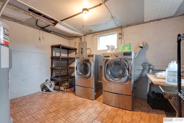 laundry area featuring light parquet flooring and separate washer and dryer