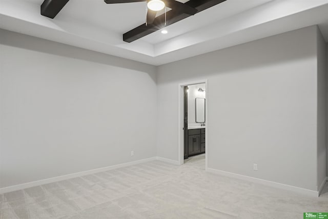 carpeted empty room with beamed ceiling and ceiling fan