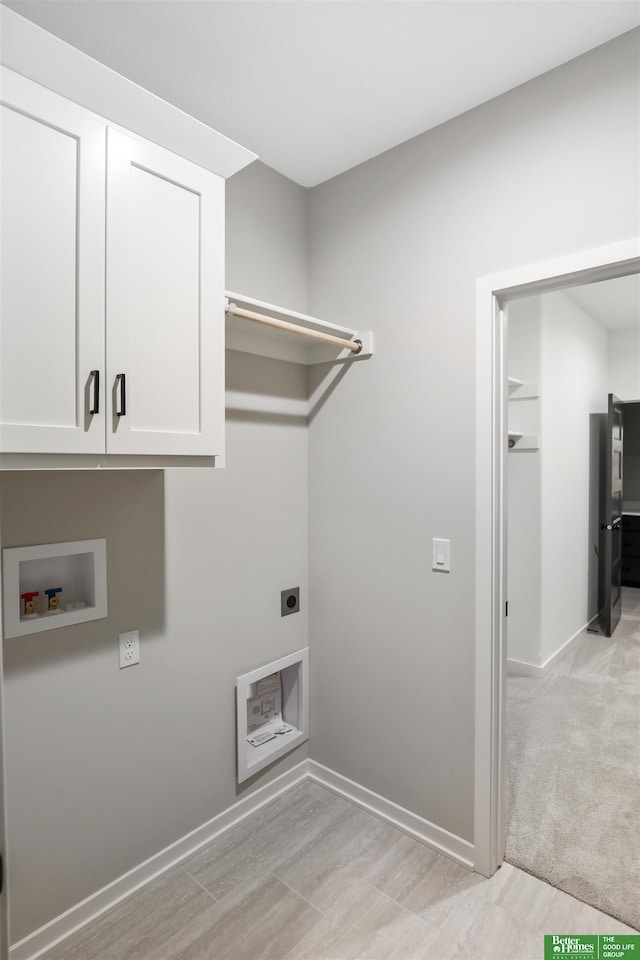 washroom featuring cabinets, hookup for a washing machine, light carpet, and electric dryer hookup