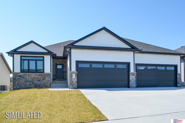 view of front of home with a front lawn and a garage