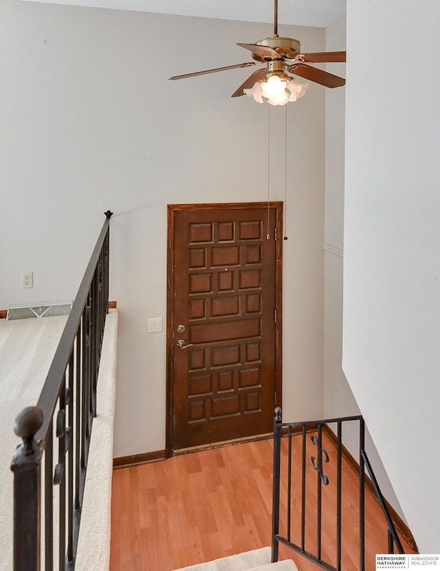 entrance foyer featuring ceiling fan and wood-type flooring