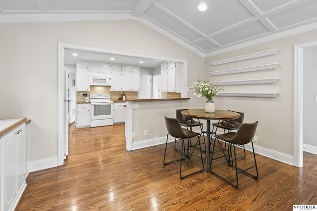 dining room with dark hardwood / wood-style flooring