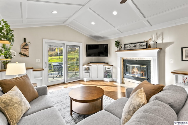 living room featuring ceiling fan, coffered ceiling, and light wood-type flooring