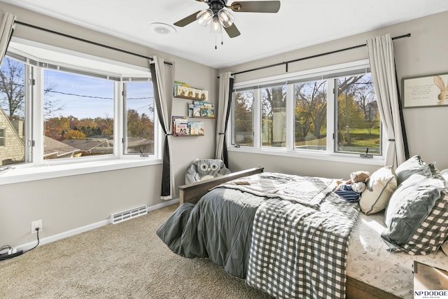 carpeted bedroom with ceiling fan