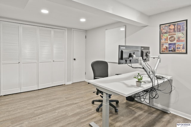 office space with wood-type flooring