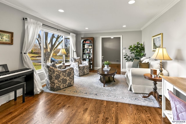 living area featuring dark wood-type flooring and ornamental molding