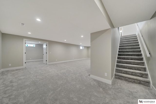 basement with light colored carpet