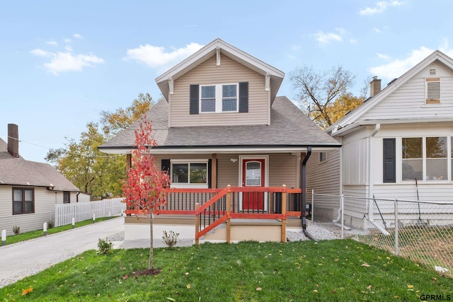 bungalow-style house with a front yard