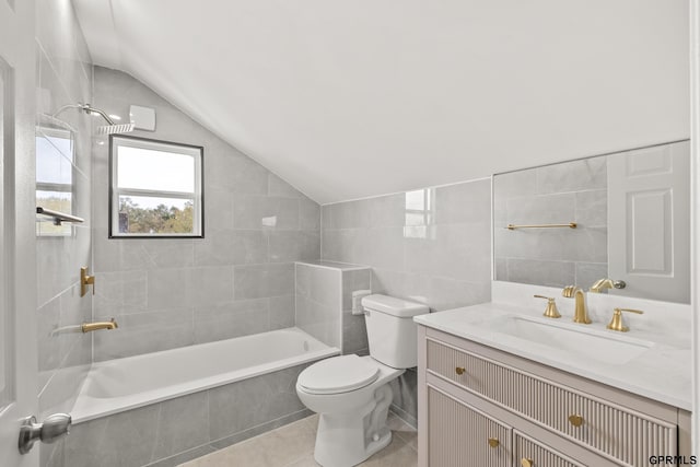 full bathroom featuring vanity, tiled shower / bath combo, tile walls, tile patterned flooring, and lofted ceiling