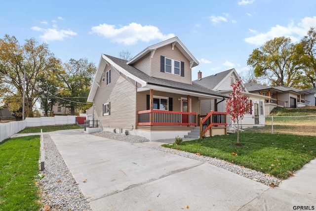 view of front of property with a front yard and a porch