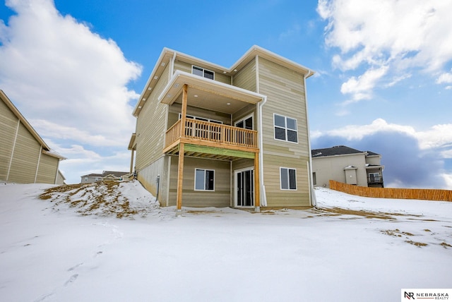 view of snow covered house