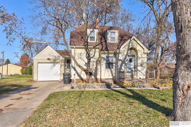 view of front facade with a front lawn and a garage