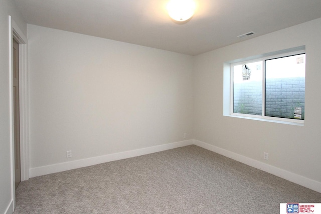 unfurnished room with carpet flooring