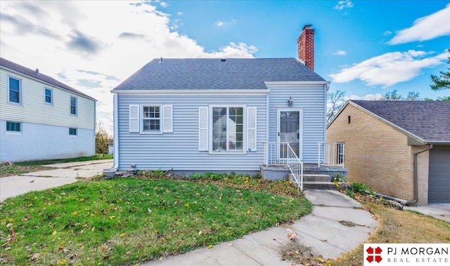 view of front of home with a front yard