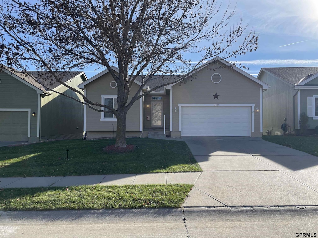 ranch-style house with a front lawn and a garage