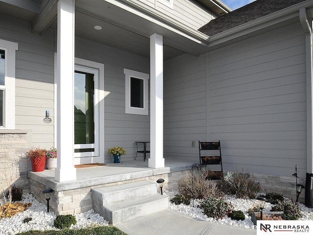 doorway to property with covered porch