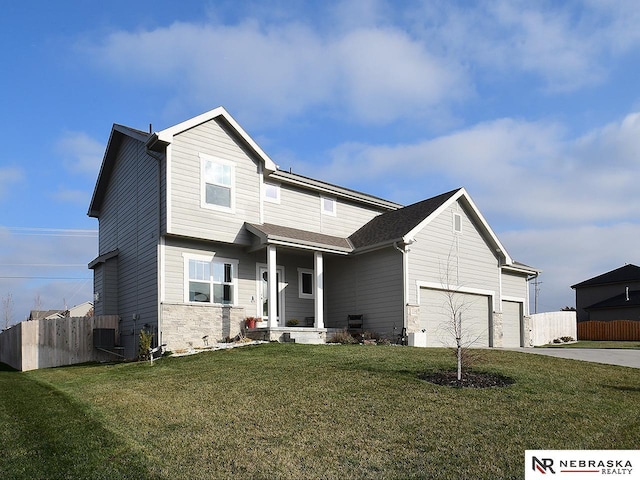 craftsman-style house with a garage and a front yard