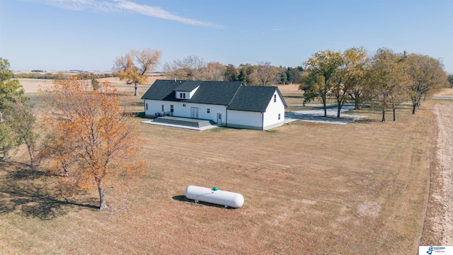 birds eye view of property featuring a rural view