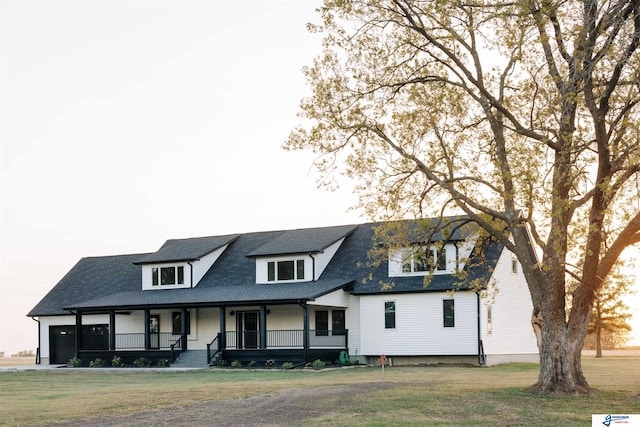 view of front of house featuring a porch and a front lawn