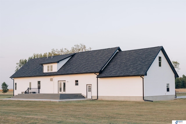 rear view of house with a lawn