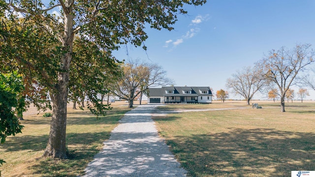 803 N 30th Rd, Syracuse, NE 68446 - view of front facade with driveway and a front lawn