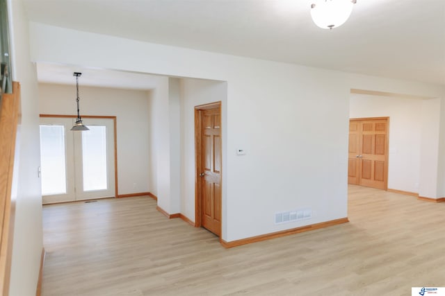 unfurnished room featuring light wood-type flooring